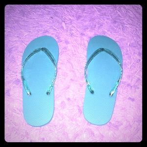 Never worn women’s sparkly flip flops